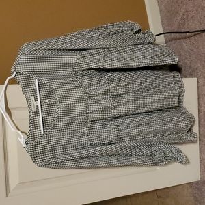 Green and white checked blouse. Three-quarter sleeves.